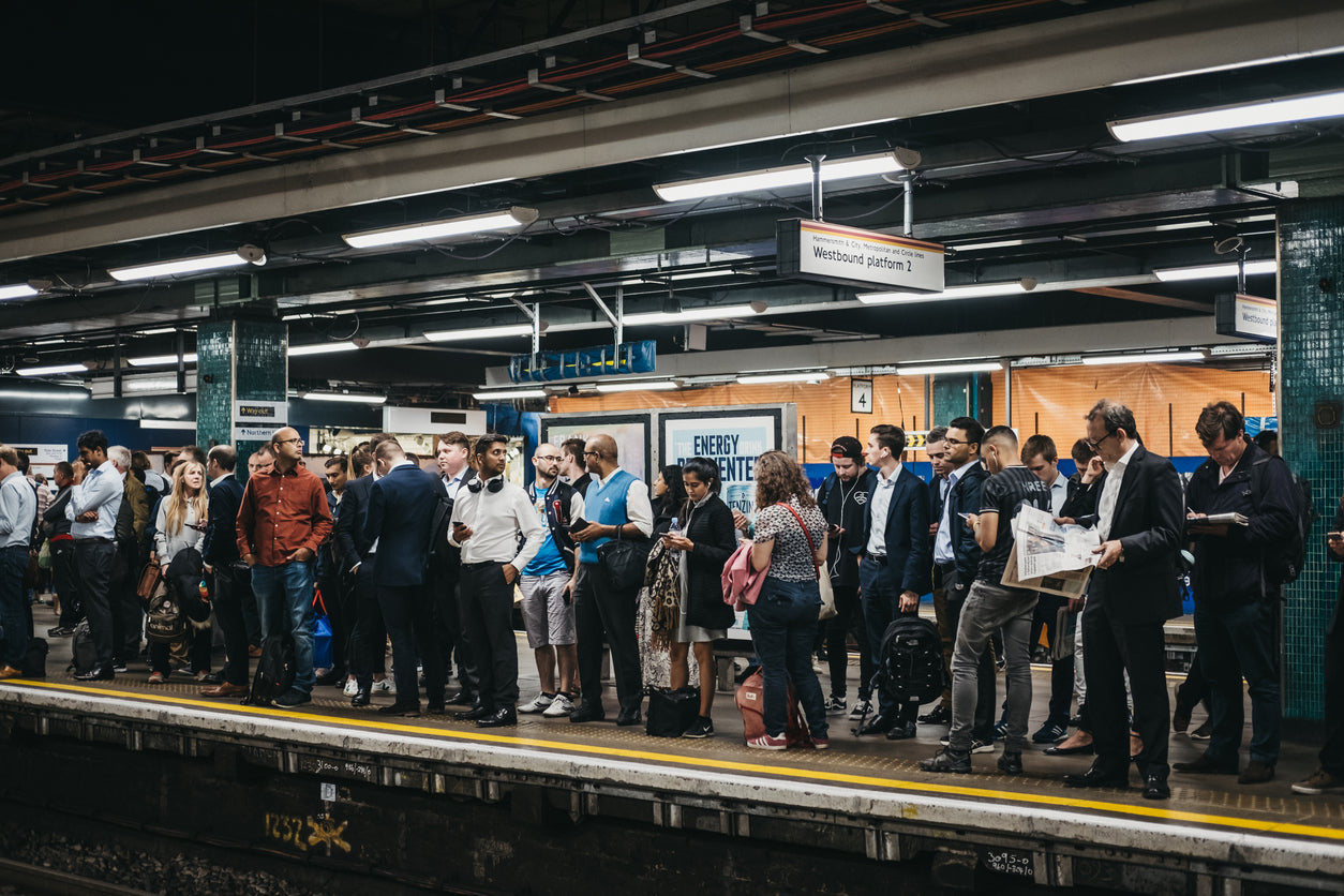 image of a busy london underground tube station, commuters to work