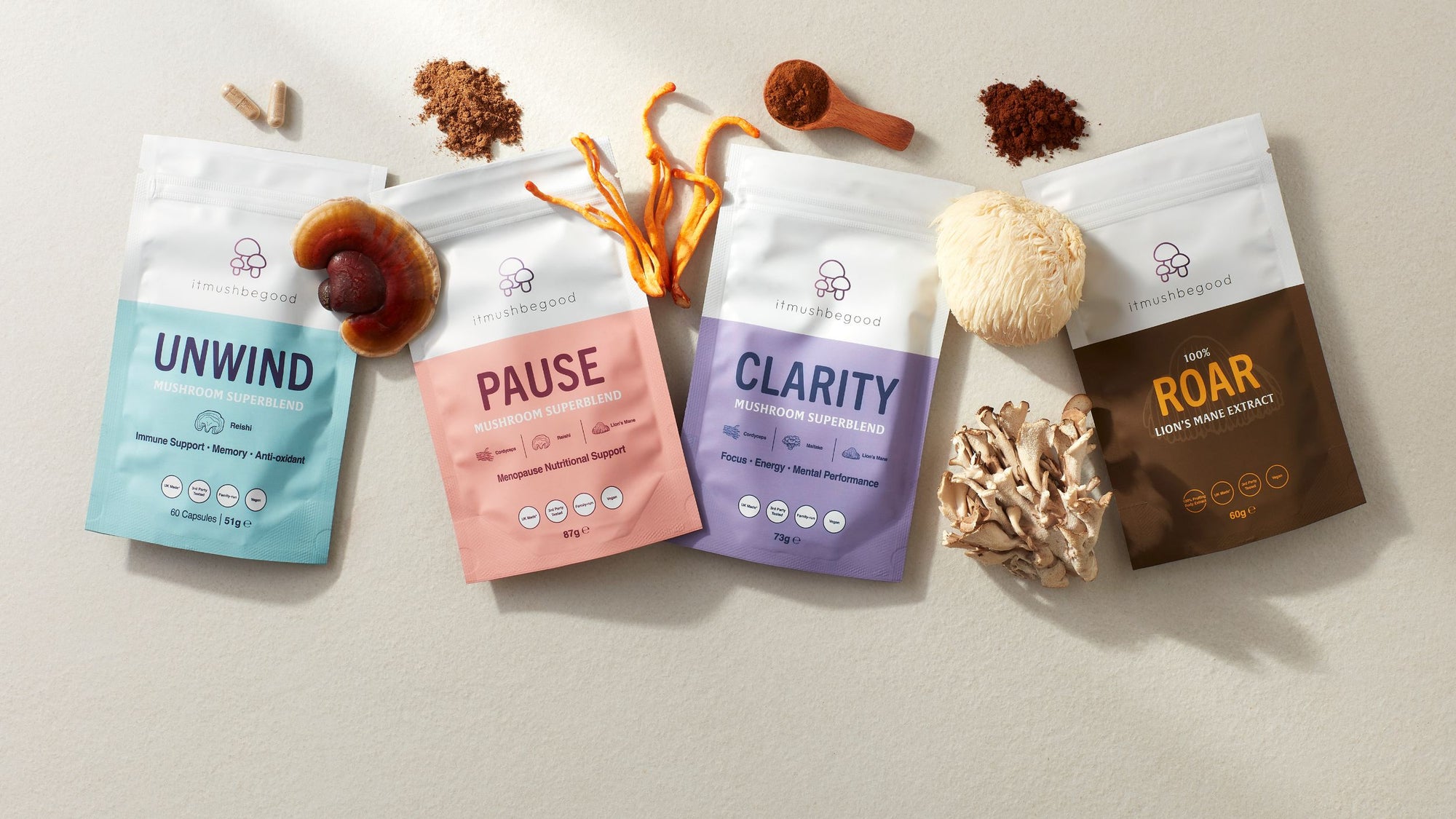 The superblend range in packaging with with reishi, cordyceps and lions mane mushrooms and a wooden spoon