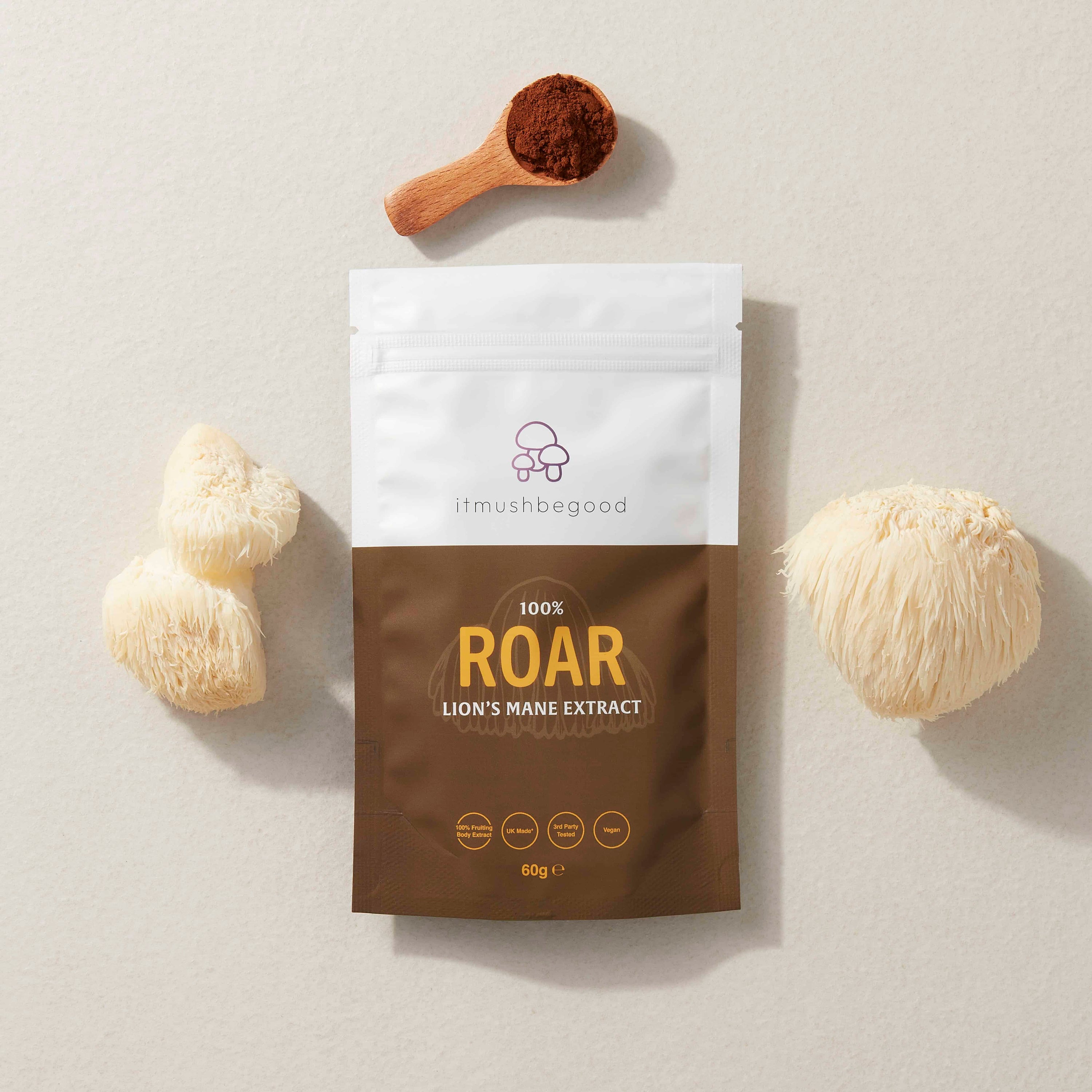 Roar functional mushroom supplement packet surrounded by ingredients and a scoop