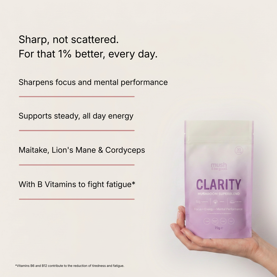 Clarity Mushroom Superblend in a light purple pouch, held in a hand. Text reads: Sharp, not scattered — for that 1% better, every day. Sharpens focus and mental performance, supports steady all-day energy, contains Maitake, Lion's Mane and Cordyceps, with B vitamins to fight fatigue. Vitamins B6 and B12 contribute to the reduction of tiredness and fatigue.